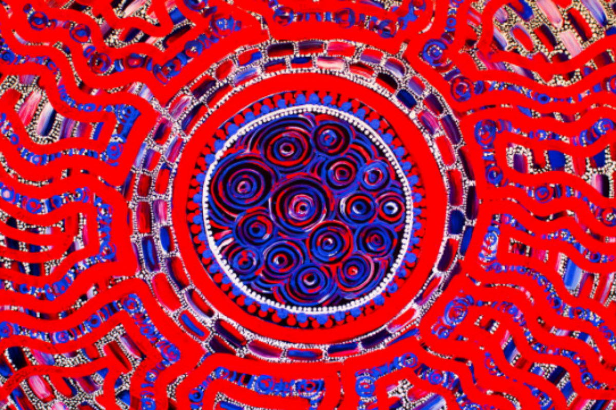 A vibrant Aboriginal artwork featuring concentric circles in deep blue, red and purple at the centre, surrounded by radiating patterns of curved lines, dotted details and rectangular shapes in bold red and blue.